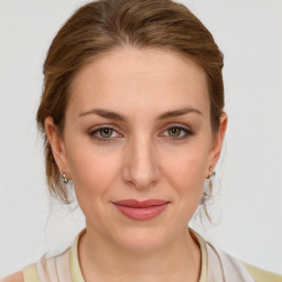 Joyful white young-adult female with medium  brown hair and blue eyes