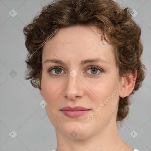 Joyful white young-adult female with medium  brown hair and green eyes