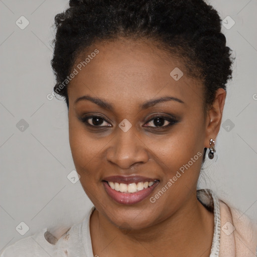 Joyful black young-adult female with short  brown hair and brown eyes