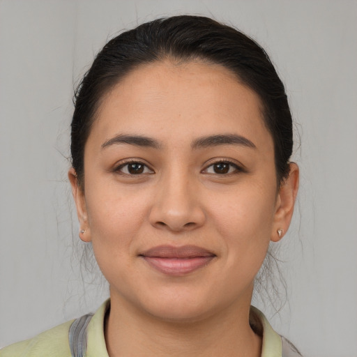 Joyful white young-adult female with medium  brown hair and brown eyes