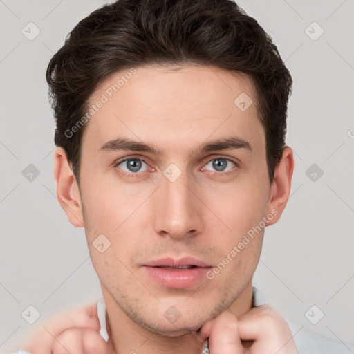 Neutral white young-adult male with short  brown hair and grey eyes