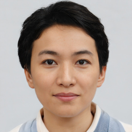 Joyful asian young-adult female with short  black hair and brown eyes