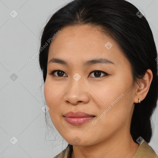 Joyful asian young-adult female with medium  black hair and brown eyes