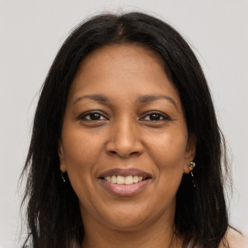 Joyful asian adult female with long  brown hair and brown eyes