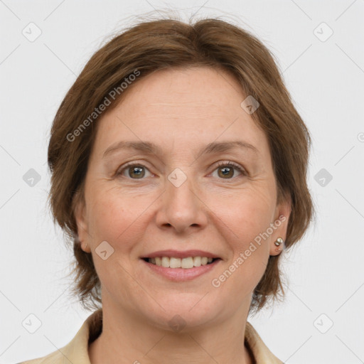 Joyful white adult female with medium  brown hair and grey eyes