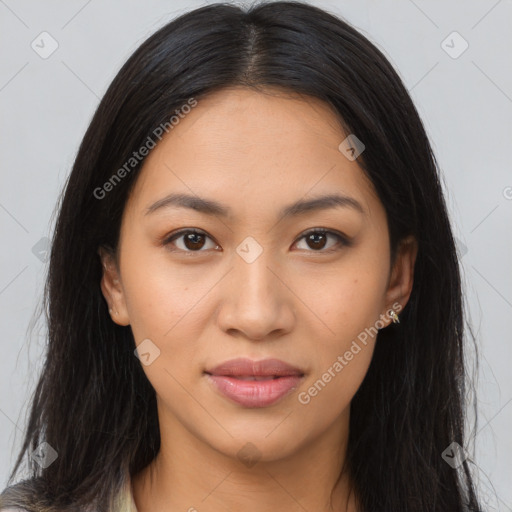 Joyful latino young-adult female with long  brown hair and brown eyes