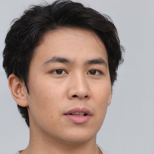 Neutral asian young-adult male with short  brown hair and brown eyes