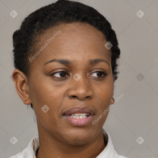 Joyful black adult female with short  brown hair and brown eyes