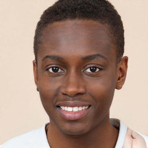 Joyful black young-adult male with short  brown hair and brown eyes