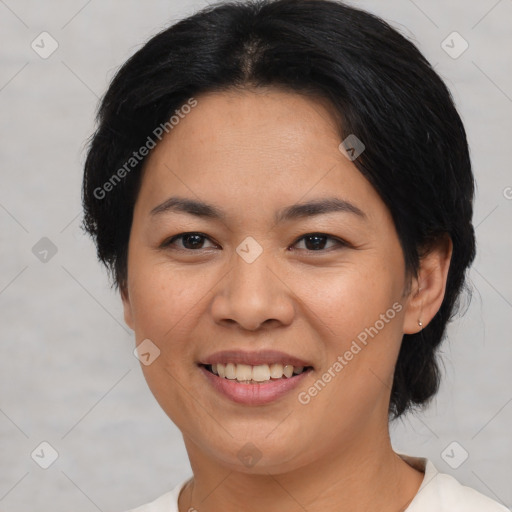 Joyful asian young-adult female with short  black hair and brown eyes