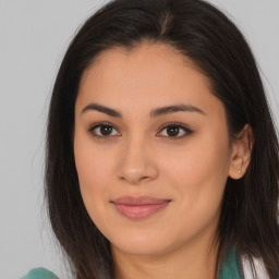 Joyful asian young-adult female with long  brown hair and brown eyes