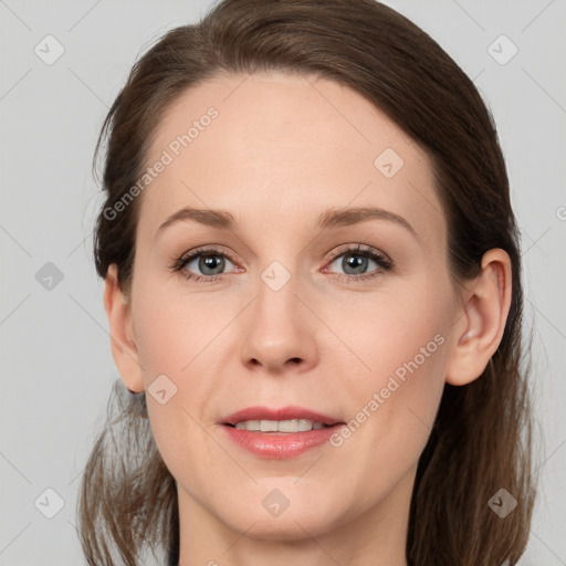 Joyful white young-adult female with medium  brown hair and grey eyes