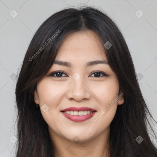 Joyful asian young-adult female with long  brown hair and brown eyes