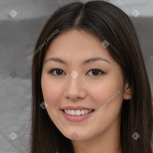 Joyful asian young-adult female with long  brown hair and brown eyes