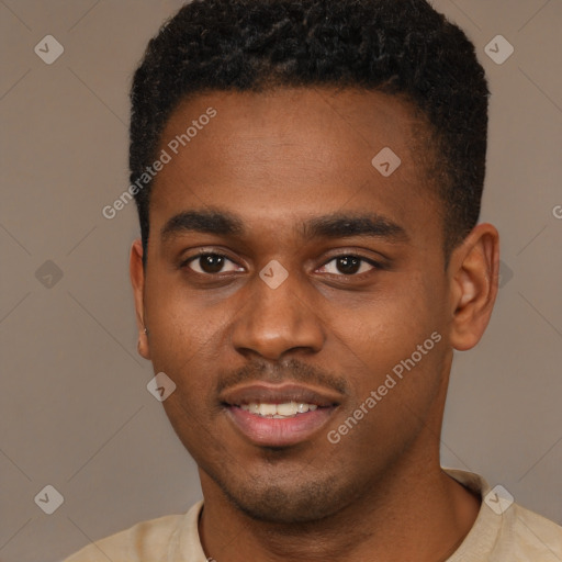 Joyful black young-adult male with short  brown hair and brown eyes