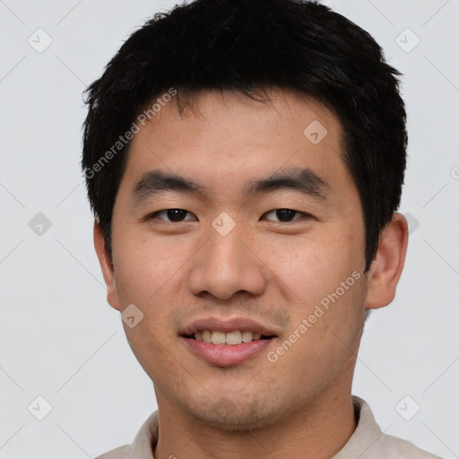 Joyful asian young-adult male with short  black hair and brown eyes