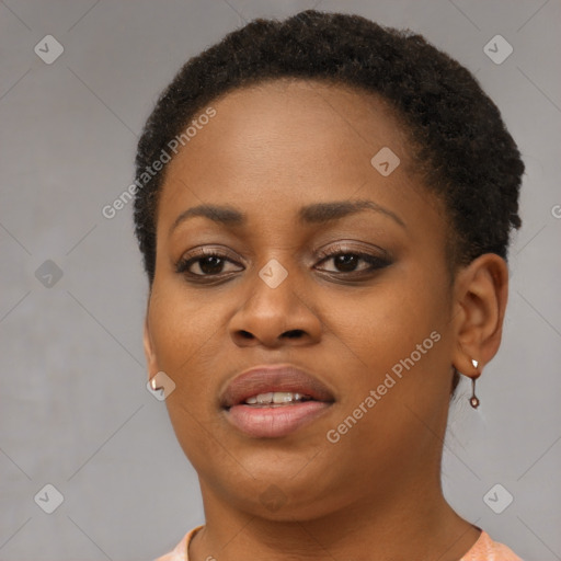 Joyful black young-adult female with short  brown hair and brown eyes