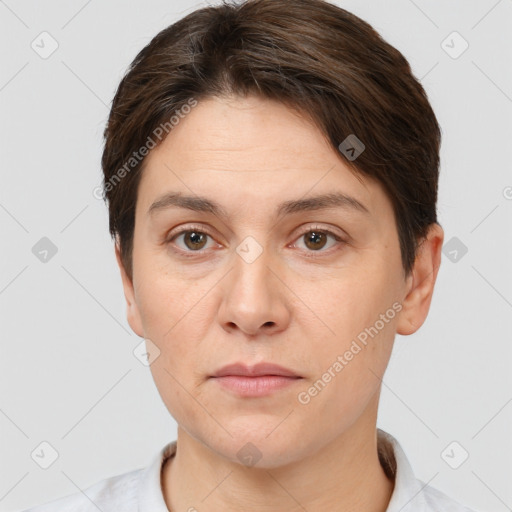 Joyful white adult female with short  brown hair and brown eyes