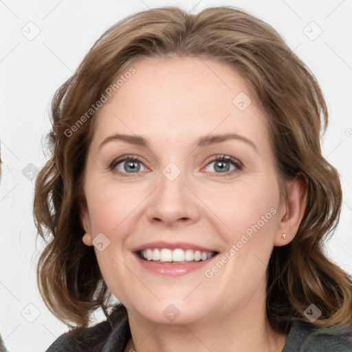 Joyful white young-adult female with medium  brown hair and blue eyes