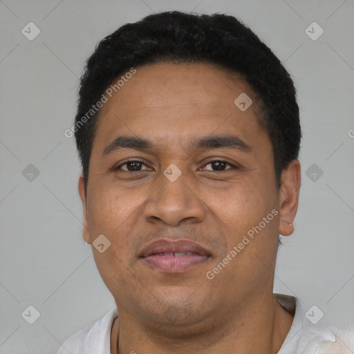 Joyful latino adult male with short  black hair and brown eyes