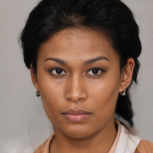 Neutral latino young-adult female with medium  brown hair and brown eyes