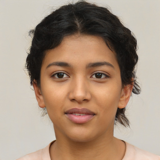 Joyful latino young-adult female with short  brown hair and brown eyes