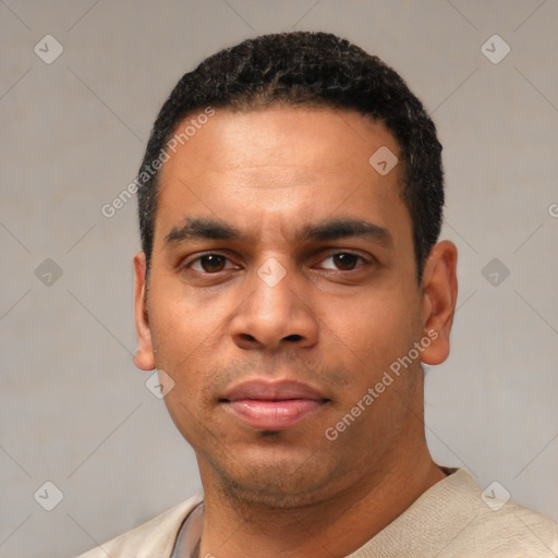 Neutral latino young-adult male with short  black hair and brown eyes