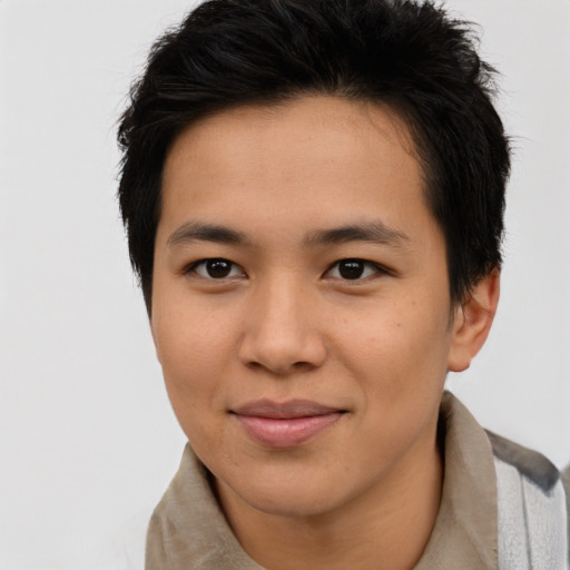 Joyful asian young-adult male with short  brown hair and brown eyes