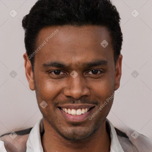 Joyful black young-adult male with short  brown hair and brown eyes