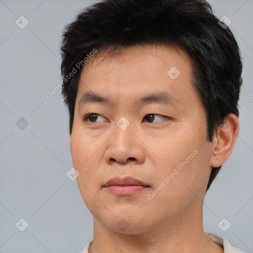 Neutral asian young-adult male with short  black hair and brown eyes