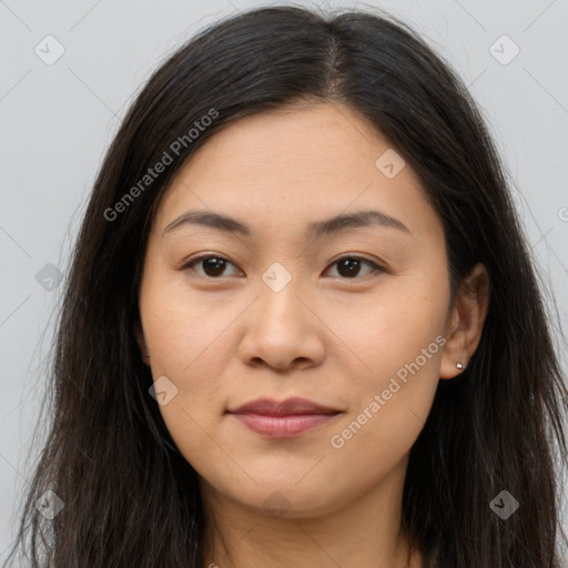 Joyful asian young-adult female with long  brown hair and brown eyes