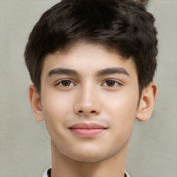 Joyful white child male with short  brown hair and brown eyes