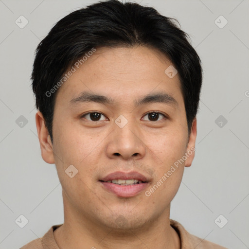 Joyful asian young-adult male with short  brown hair and brown eyes