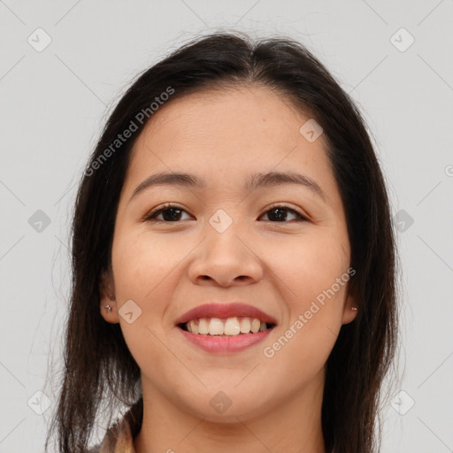 Joyful asian young-adult female with long  brown hair and brown eyes