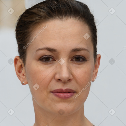 Joyful white adult female with short  brown hair and brown eyes