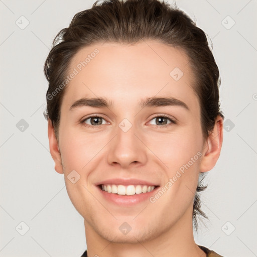 Joyful white young-adult female with short  brown hair and brown eyes