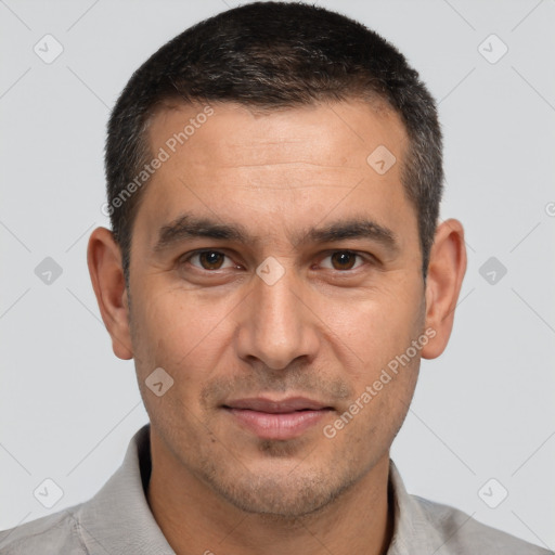 Joyful white adult male with short  brown hair and brown eyes