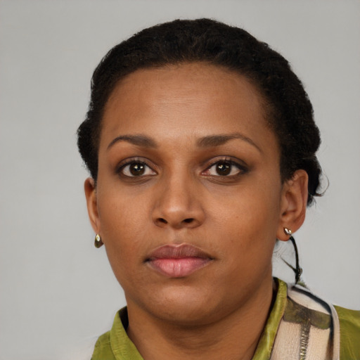Neutral black young-adult female with short  black hair and brown eyes