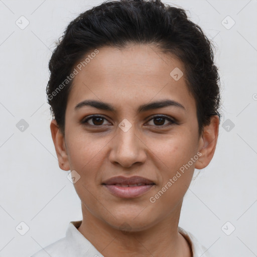 Joyful latino young-adult female with short  brown hair and brown eyes