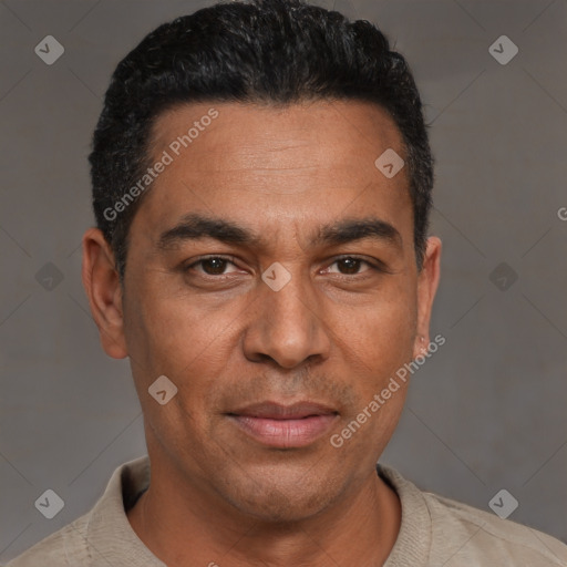 Joyful white adult male with short  black hair and brown eyes