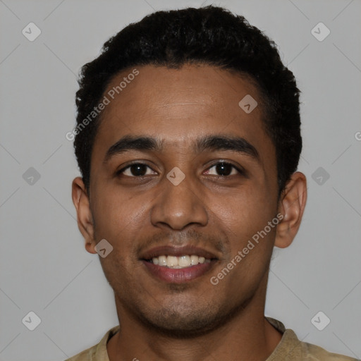 Joyful black young-adult male with short  black hair and brown eyes