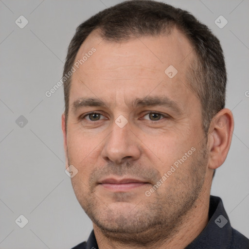 Joyful white adult male with short  brown hair and brown eyes