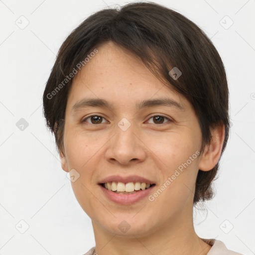 Joyful white young-adult female with short  brown hair and brown eyes