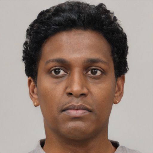 Neutral black young-adult male with short  black hair and brown eyes