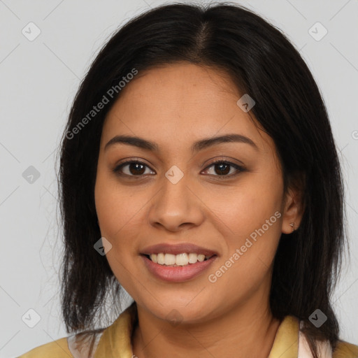 Joyful latino young-adult female with medium  brown hair and brown eyes