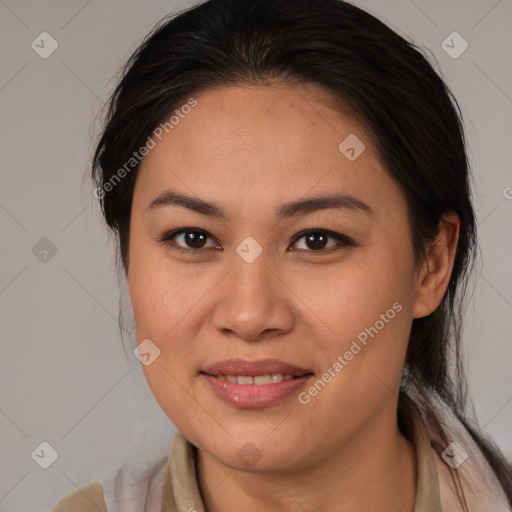 Joyful latino young-adult female with medium  brown hair and brown eyes