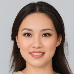 Joyful asian young-adult female with medium  brown hair and brown eyes