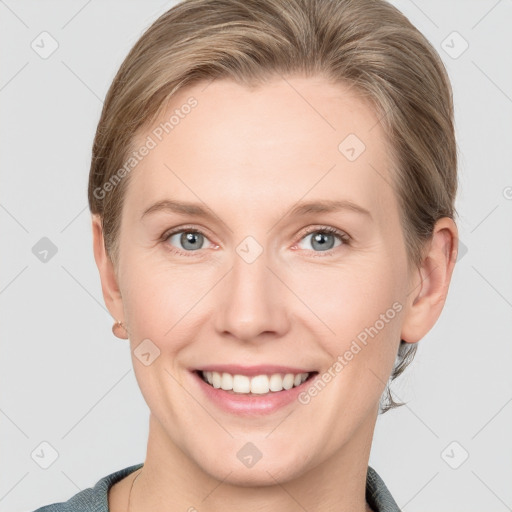 Joyful white young-adult female with short  brown hair and grey eyes