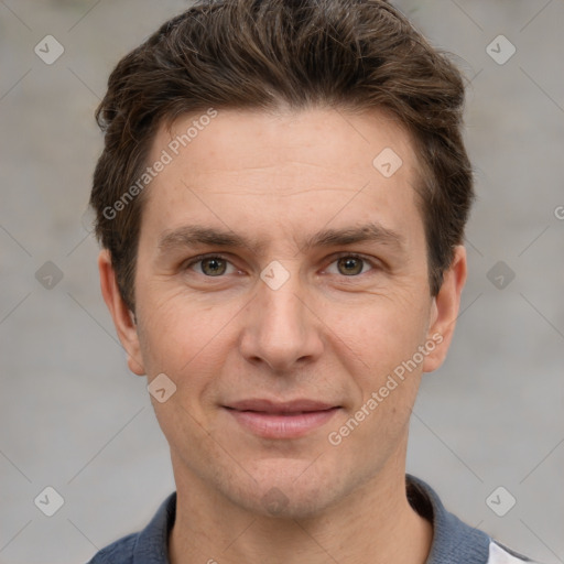 Joyful white adult male with short  brown hair and grey eyes