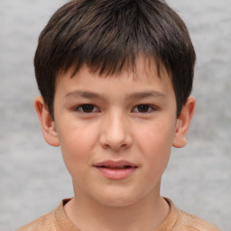 Joyful white child male with short  brown hair and brown eyes